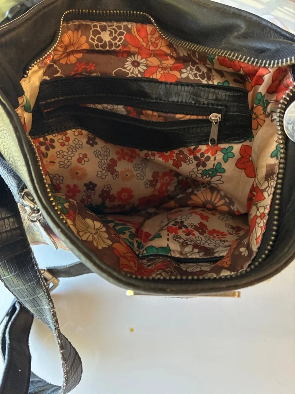 Black Crossbody Leather Bag with Religious Print on outside and floral print in